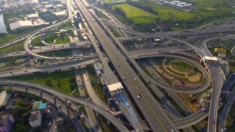 Aerial View of Highway Road Interchange with Busy Urban Traffic Speeding on Road Stock Footage