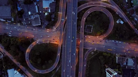 Aerial view of highway road interchange with busy car speeding at night Stock-Footage 90808110