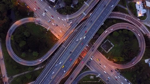 Aerial view of highway road interchange with busy car speeding at night Stock Footage 90951202