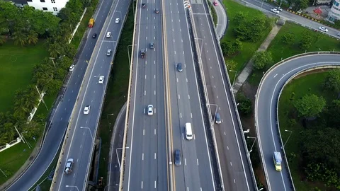 Aerial view of highway road interchange with busy urban traffic speeding Stock-Footage 90983265