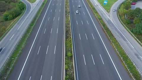 Aerial view of highway road interchange with busy urban traffic Stock Footage 254355326