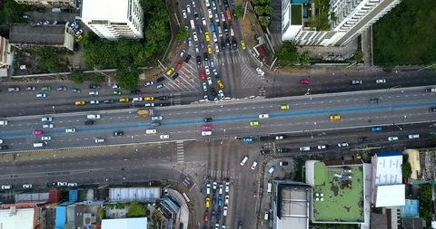 Aerial view of highway road intersection with busy urban traffic speeding Stock-Footage 98159211