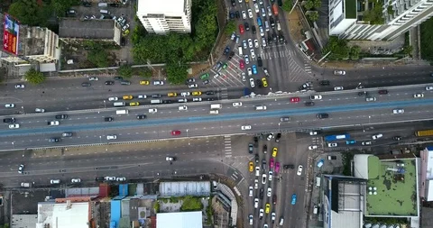 Aerial view of highway road intersection with busy urban traffic speeding Stock-Footage 98160689
