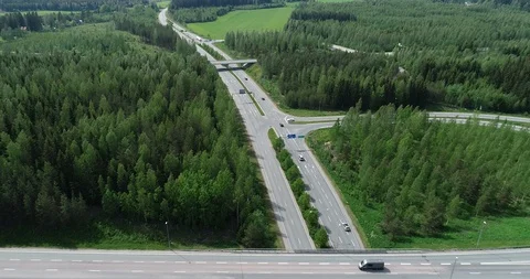 Aerial view highway with road junction and bridges on a Sunny summer day Stock Footage 111399720