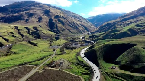 Aerial view of highway road through agricultural farm fields Video stock 333764977