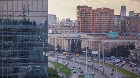 Aerial view of highway from skyscraper, TimeLapse shot with vertical pan Stockbeeldmateriaal 83270046