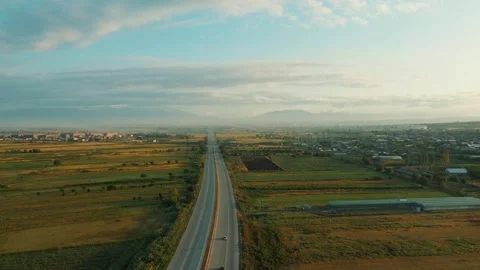 Aerial view of the highway through the fields 4 Stock-Footage 318897364