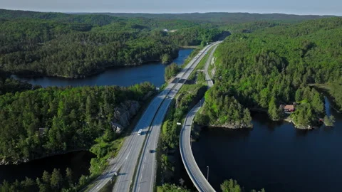 Aerial view of highway through forest near Kristiansand. Stock Footage 328128259