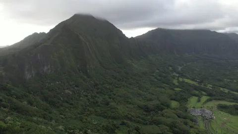 Aerial view of Highway through mountains of Oahu, Hawaii Stock Footage 164085385