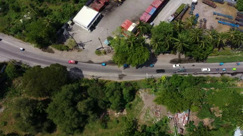 Aerial view of a highway through a small town in General Santos, Philippines Stock Footage 267021769