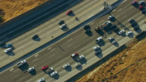 Aerial view of highway with yellow grass on a sunny day in Los Angeles, Californ Stock Footage 199461683