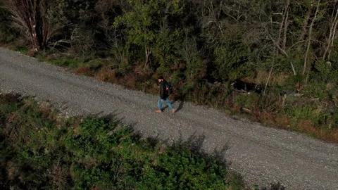 Aerial view of hike man with backpack walking alone in the nature. Drone shot Stock Footage 143157825