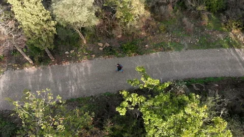 Aerial view of hike man with backpack walking alone in the nature. Drone shot Stock Footage 143158466