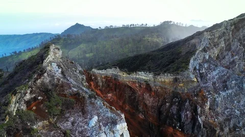 Aerial view of a hill with the mountains in the background near Kawah Ijen Stock Footage 127119781
