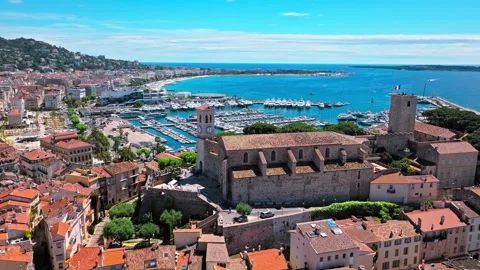 Aerial view Hilltop Gothic-style stone church with city views in Cannes. Stock Footage 281011043