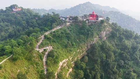 Aerial view of a hilltop temple complex with a winding path for Travel Stockbeeldmateriaal 347770626