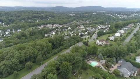 Aerial view of a hilly suburban development. Video stock 102783313