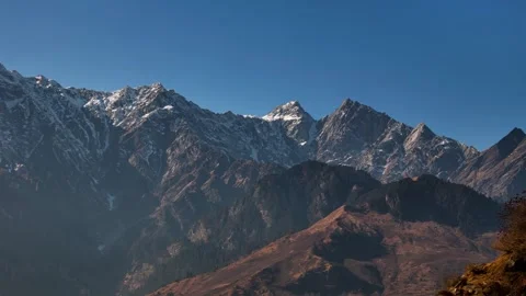 Aerial View of Himalayan Snow Covered Mountain Peaks on a Bright Sunny Day Stock Footage 340966937