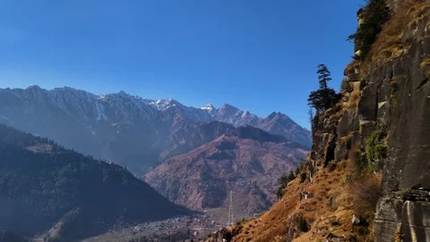 Aerial View of Himalayan Snow Covered Mountain Peaks on a Bright Sunny Day Stock Footage 340966941