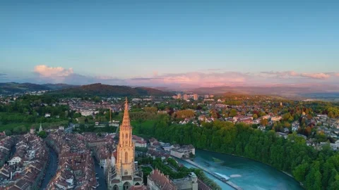 Aerial view of the historic Bern Minster cathedral towering over the Old Town. Video stock 343552626