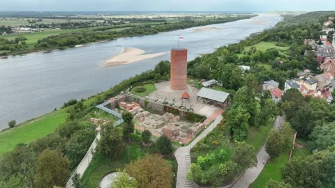 Aerial View of Historic Brick Tower and Castle Ruins by River-seg01 Video stock 328669699