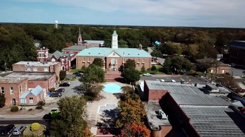 Aerial view of a historic courthouse building surrounded by a charming town.. Stock Footage 337601946