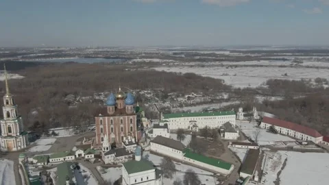 Aerial view of historic monastery surrounded by snowy fields Stock Footage 320842809