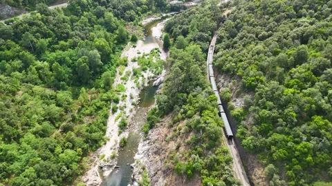 Aerial View of Historic Steam Train Crossing Stone Railway Viaduct near Anduze Stock-Footage 340344972