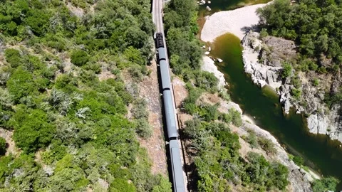 Aerial View of Historic Steam Train Crossing Stone Railway Viaduct near Anduze Stock Footage 340350144