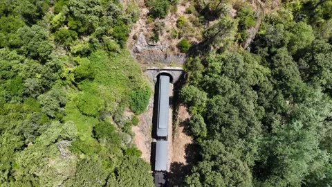 Aerial View of Historic Steam Train Crossing Stone Railway Viaduct near Anduze Stock Footage 340351101