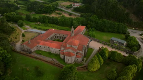 Aerial view of a historic stone monastery complex with vibrant orange terracotta 库存影片 335722929