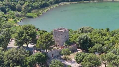 Aerial view of historic stone tower near the water, Albania. Stock Footage 345656833