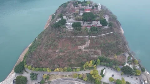 Aerial view of a historic temple complex on a forested island in the river Stock Footage 342305764