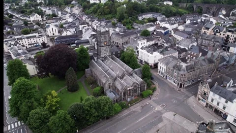 Aerial View of a Historic Town Featuring a Beautiful Church and Lush Green Stock Footage 320799451