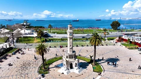 Aerial view of the historical clock tower, the symbol of izmir, with birds Stock Footage 242401529
