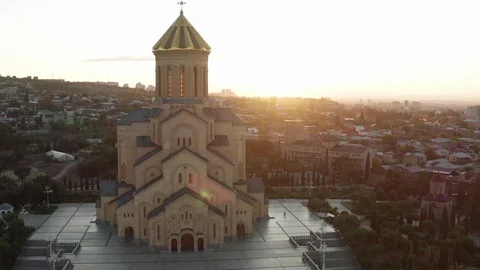Aerial view of Holy Trinity Cathedral of Tbilisi Georgia at sunset drone Stock Footage 122619923