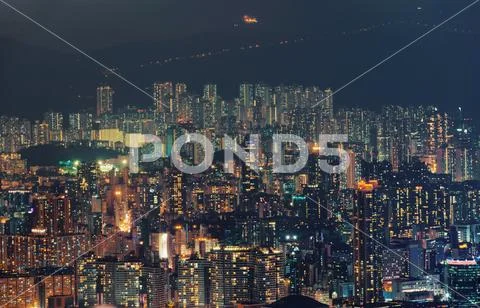Aerial view of Hong Kong apartments and mountain in cityscape background. Res Stock Photos