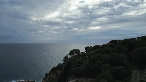 Aerial view of the horizon with dark cloudy sky during sunset, 4K Stock Footage 267620280