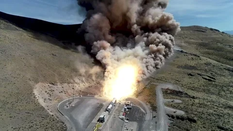 Aerial view of hot fire test of a Space Launch System solid rocket booster Stock Footage 281724139