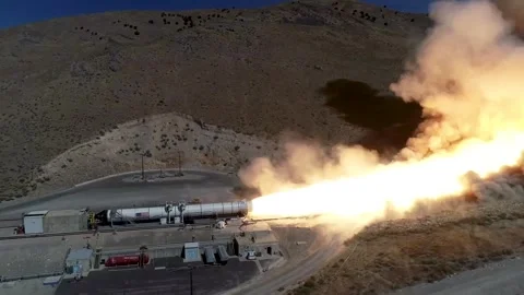Aerial view of hot fire test of a Space Launch System solid rocket booster Stock Footage 281724158