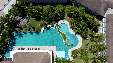 Aerial view of the hotel pool surrounded by buildings Stock Footage 170118120