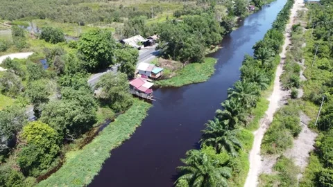 Aerial view of the house, the kitchen area stands above the river Video stock 321845351