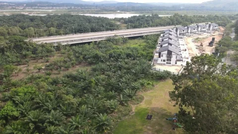 Aerial view of housing area, forest, lake and highway in Kajang Stock Footage 149279357