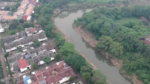 An aerial view of housing complex next to a river Stock Footage 150411816