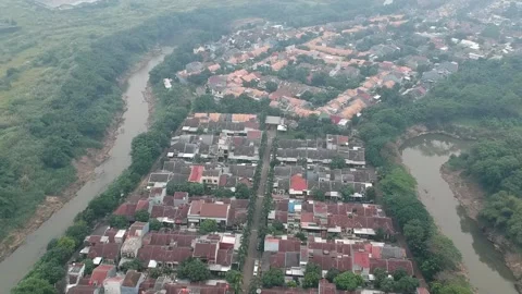 An aerial view of housing complex next to a river Stock Footage 150411907