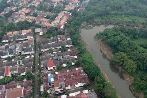 An aerial view of housing complex next a river Stock Photos