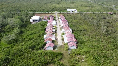 Aerial view of a housing complex with small plots of land so that only a fe.. Stock Footage 317007713