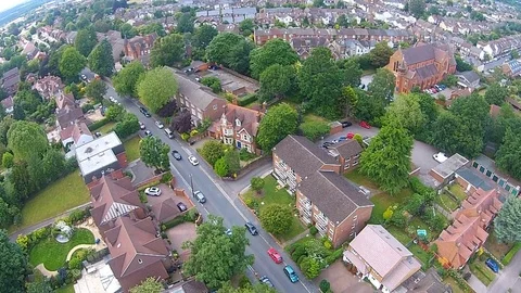 Aerial view of housing &amp; trees, affluent suburb on the outskirts of London Stock-Footage 80290051
