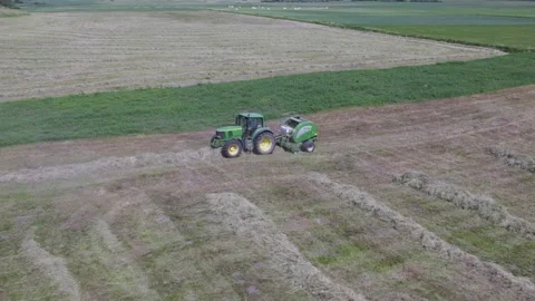 Aerial view how tractor making bales Stock Footage 198798945