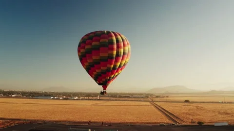 Aerial view of huge balloon in backlit sunrise light Stock Footage 134667724